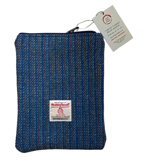 Blue striped pouch with a brand label on a white surface